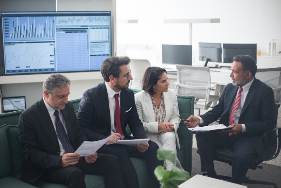 Executives in deep discussion during ethical economics leadership workshop